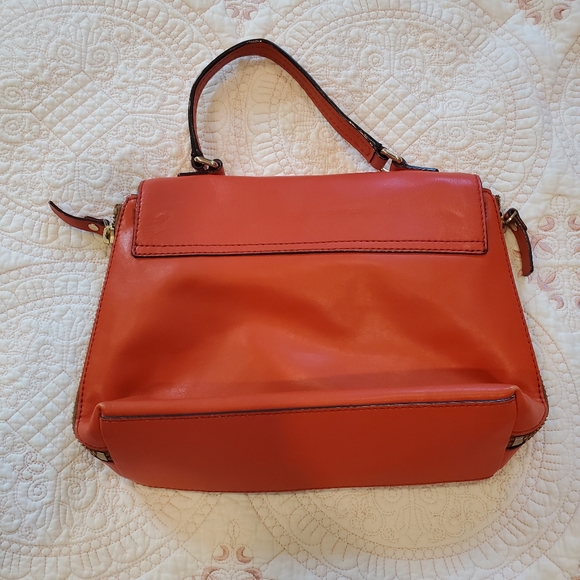 Kate Spade orange leather purse.  12" x 9" Two side zippers three inside pockets - Picture 3 of 11
